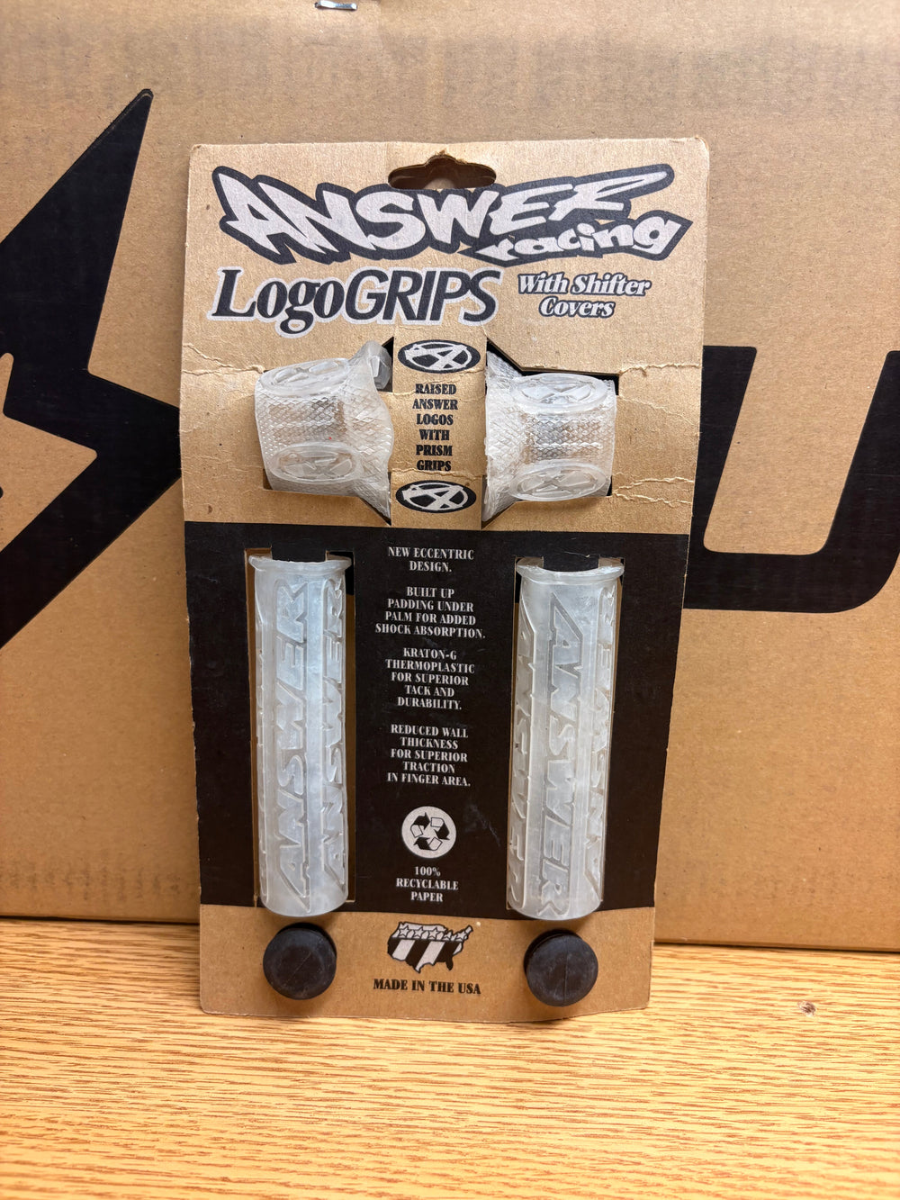 Clear Answer Racing eBike grips displayed against a white background, showing textured surface and ergonomic design.