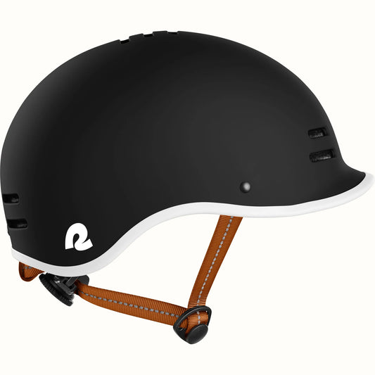 Matte black Retrospec Remi eBike helmet, side view, with adjustable straps and ventilation holes