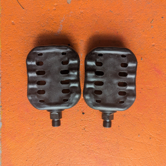 Metal eBike pedals in beach cruiser style, shown from a side angle on a white background.