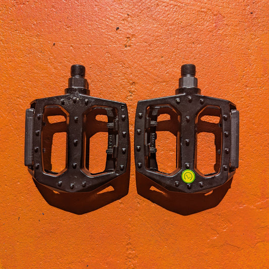 Close-up view of a pair of metal eBike pedals in Style 3, featuring a textured surface and sturdy construction, displayed on a white background.