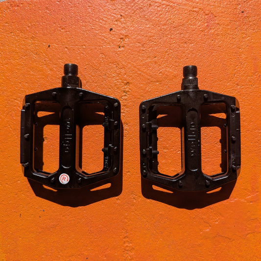 Metal eBike pedals in Style 4 design, featuring a sturdy, textured surface and open frame for enhanced grip and durability, shown against a plain background.