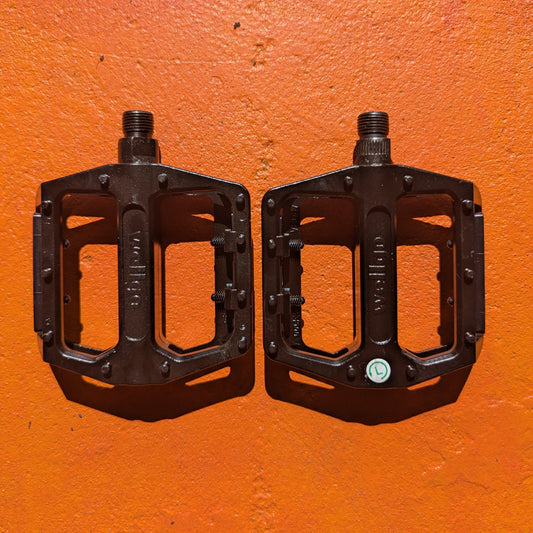 Close-up view of metal eBike pedals in Style 4, showcasing a sturdy, textured surface and durable construction.