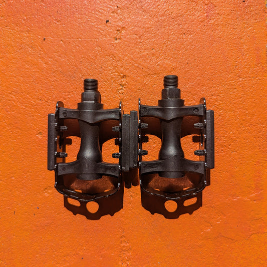 Close-up view of metal eBike pedals in Style 5, showcasing the textured surface and sturdy construction.