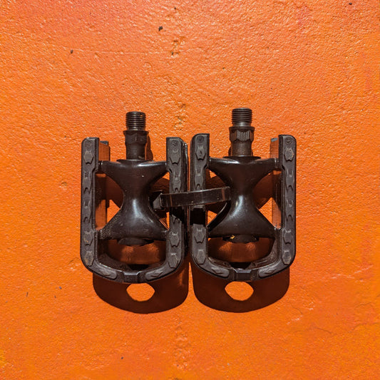 Metal eBike pedals in Style 6 design, featuring a sturdy, rectangular platform with textured surface and multiple grip pins for enhanced traction, shown in a close-up product image.