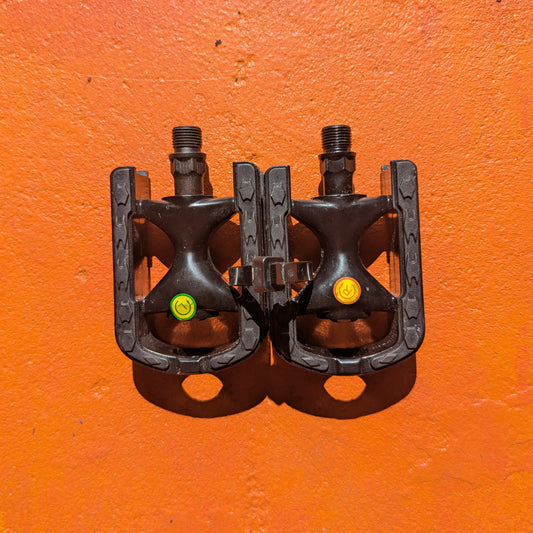Close-up view of metal eBike pedals in Style 6, showcasing a sturdy, textured surface and a modern, angular design.