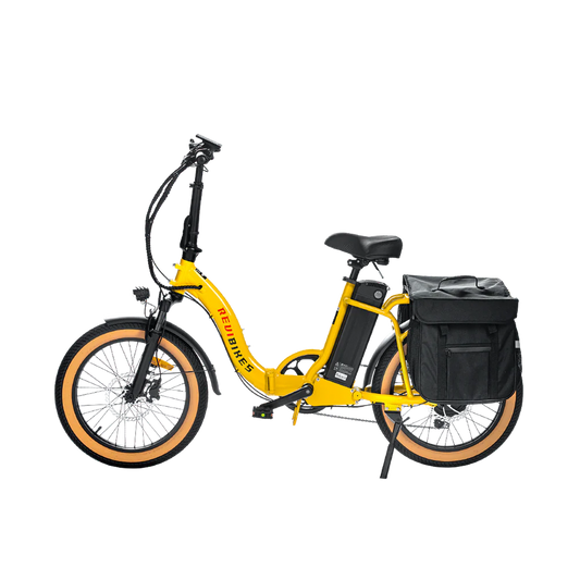 Yellow eBike Revi Rebel.2 electric bicycle side view with black tires and frame accents