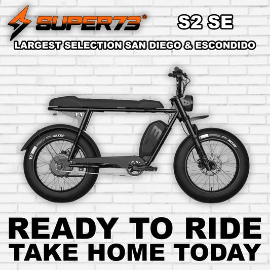 Super73 S2 SE electric bike in R2R Blackout color, side view, black frame with black wheels and seat, displayed on a white background