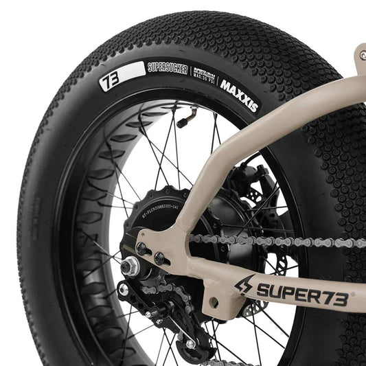 Side view of a Maxxis SuperSucker 20x5 eBike tire, showcasing the tread pattern and branding on the sidewall.