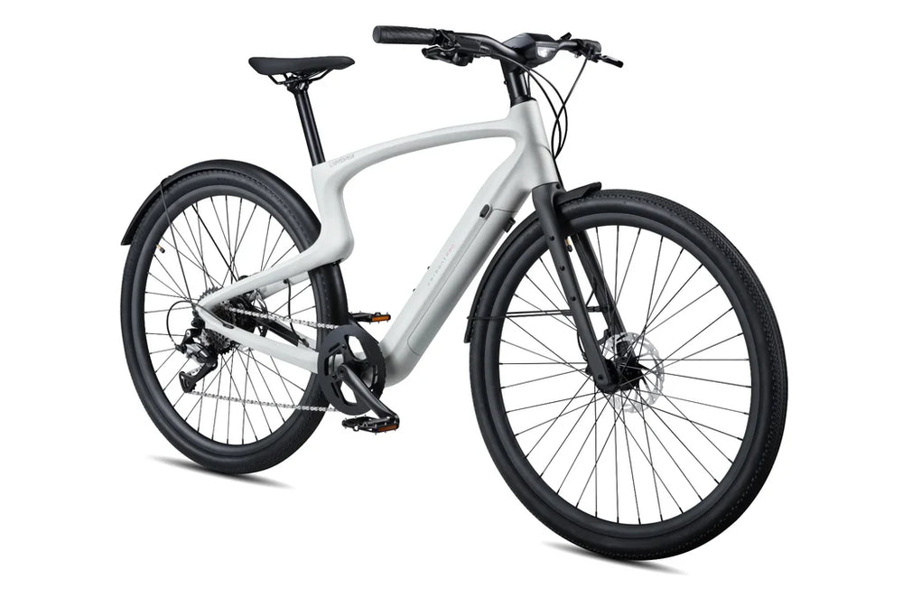 Side view of the Urtopia Carbon 1 Pro eBike in creme color, showcasing its lightweight carbon frame, sleek design, and integrated display on the handlebars.