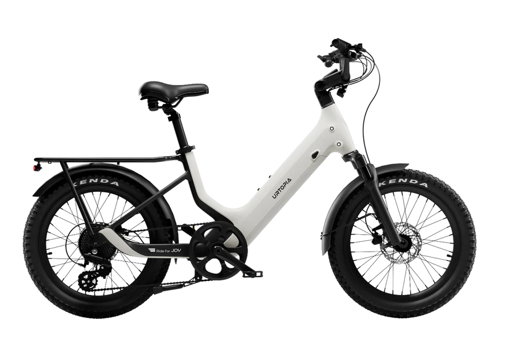 Urtopia Carbon Joy eBike in Creme color, side view, showcasing lightweight carbon frame and modern design.