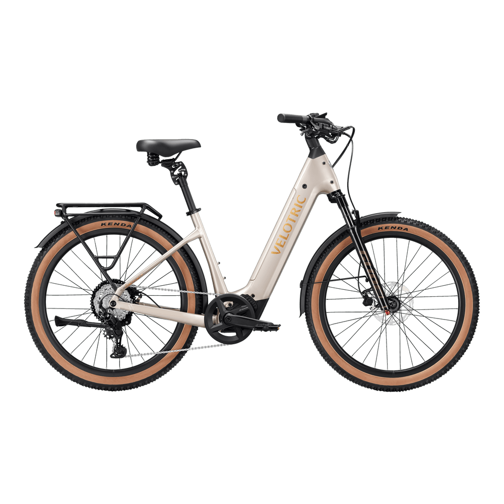 Platinum Silver Velotric Discover M eBike side view, showcasing step-through frame, front suspension fork, and rear rack