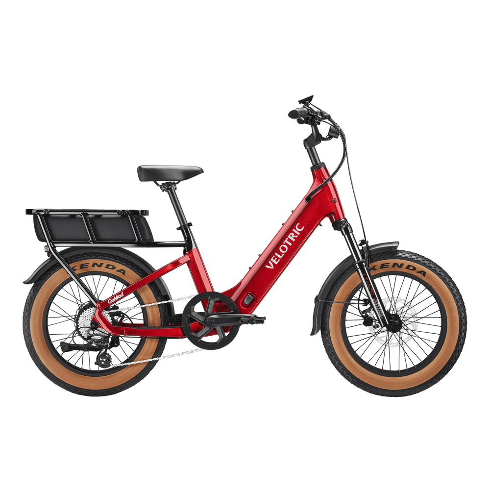 Velotric GoMad eBike in Dark Amber color, side view, showcasing its frame, wheels, and battery against a plain background.