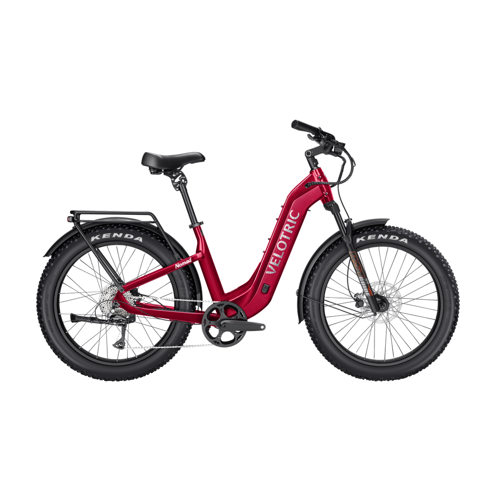 Velotric Nomad 2 electric bike in cranberry red, side view, against a white background