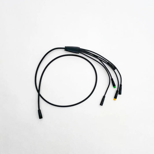 Close-up view of the Super73 R/RX/S2 eBike wiring harness showing multiple colored wires and connectors arranged for installation.