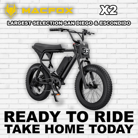 Black Macfox X2 electric bike side view, showcasing rugged frame, thick tires, and battery pack on a white background.