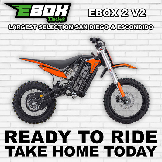 eMOTO Ebox 2 V2 electric bike in orange, side view, displayed against a white background