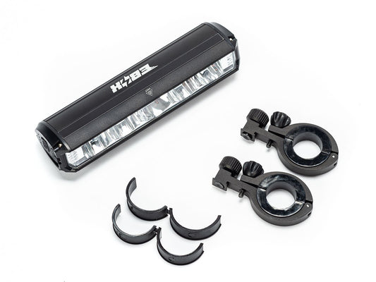 Front view of the eMOTO EBOX Dawn Headlight, showing its compact rectangular design with a clear lens and black housing.