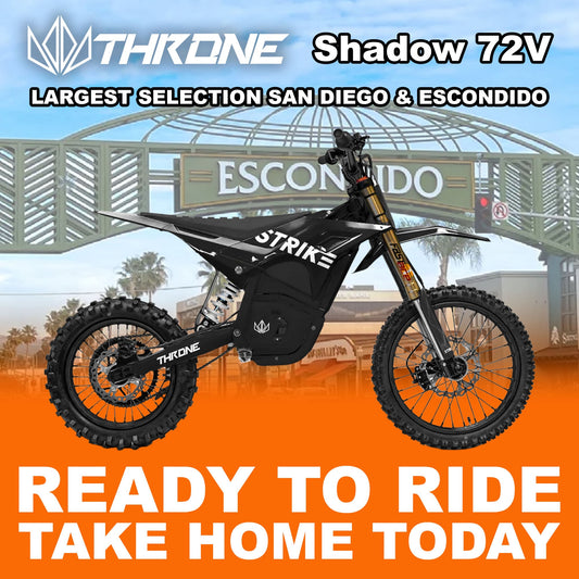 A black eMOTO Strike Shadow SV2 72V electric motorcycle, side view, on a plain background.