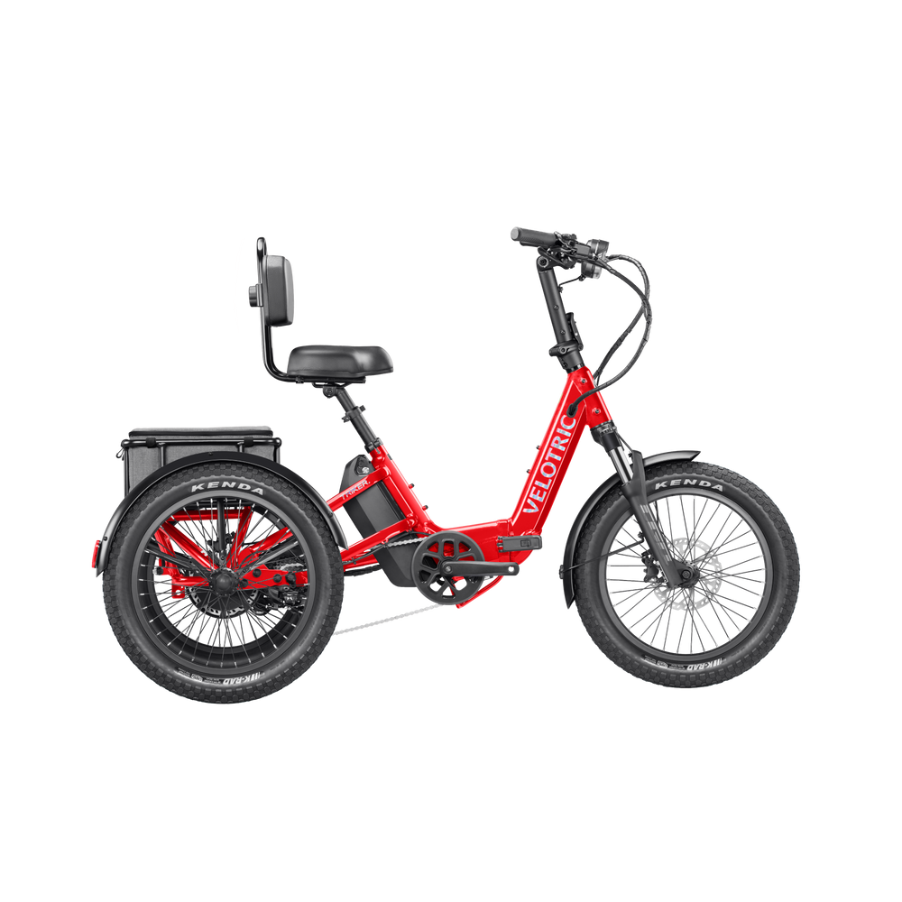 A cherry crimson Velotric Triker eTrike shown from a side angle, highlighting its three-wheel design and modern frame.