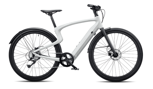 Urtopia Carbon1 Pro eBike in creme color, shown inside its original box with packaging materials.