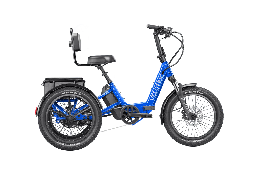 Electric blue Velotric Triker eTrike shown from side view, featuring three wheels, ergonomic seat, and modern frame design.