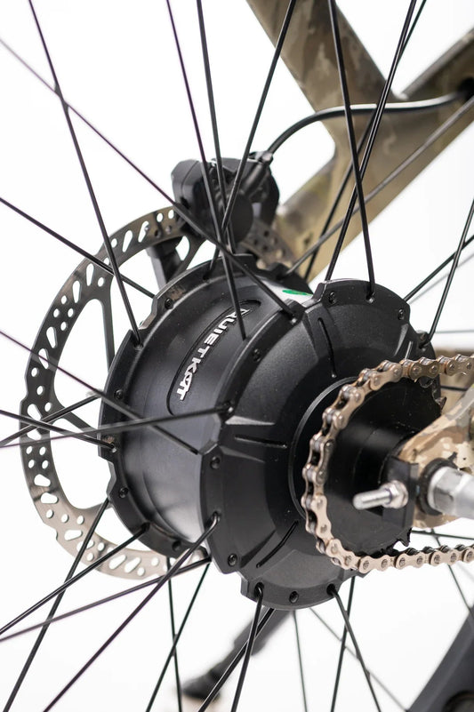 A QuietKat Ranger AWD 750w Step Over eBike with 26x4.5 fat tires, shown from the side on a mountain trail.