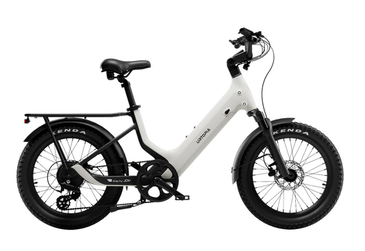 A cream-colored Urtopia Carbon Joy eBike displayed from a side angle, highlighting its lightweight carbon frame, sleek design, and integrated components against a plain background.