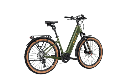 Side view of the Velotric Discover M eBike in a studio setting, showcasing its step-through frame, battery placement, and rear cargo rack.