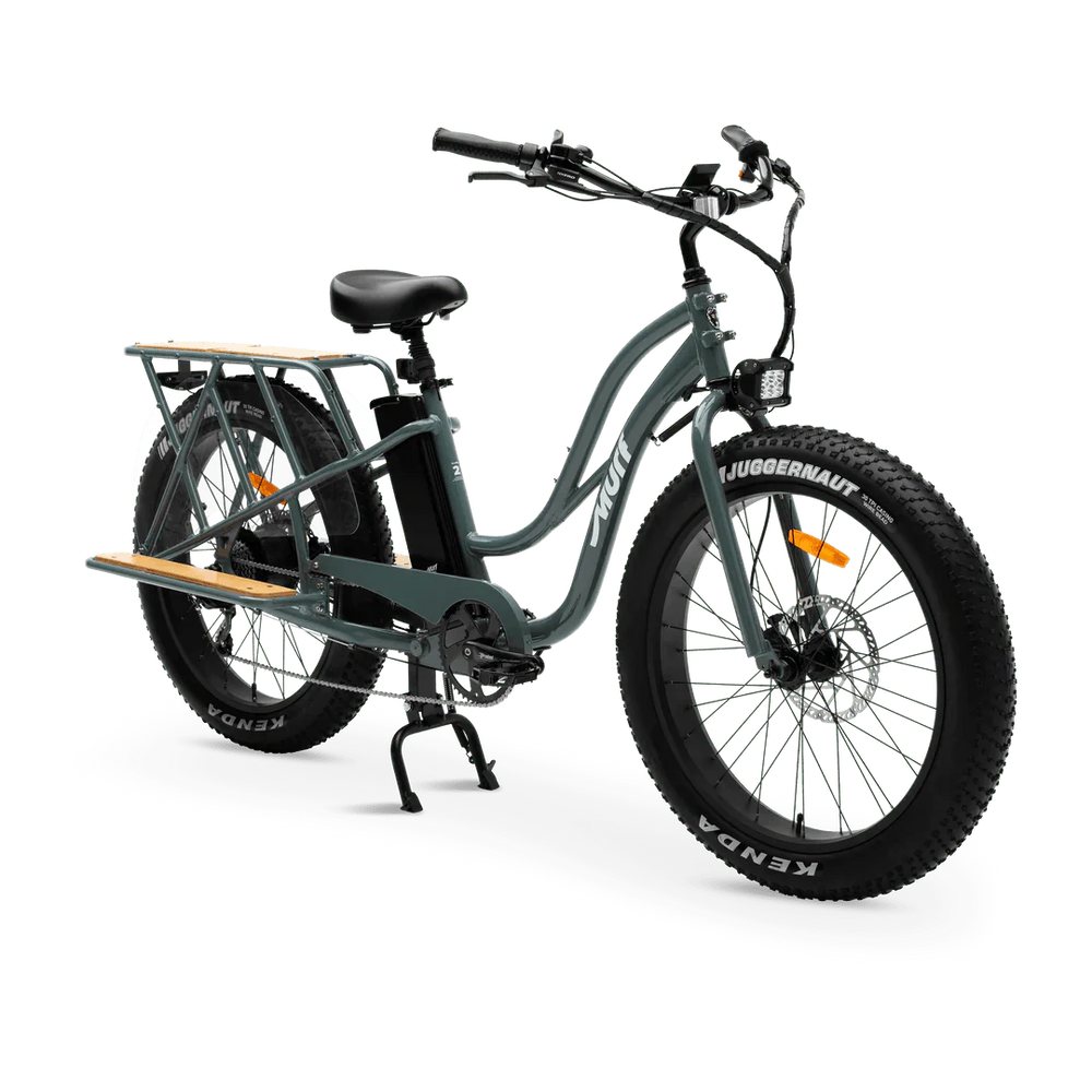 Murf Alpha Cargo fat tire electric beach cruiser e-bike, 52V 750W, designed for carrying cargo, shown in a shop setting.