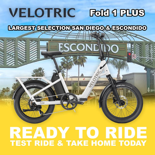 Pearl white Velotric Fold 1 PLUS eBike, folded and ready to ride, shown against a white background.