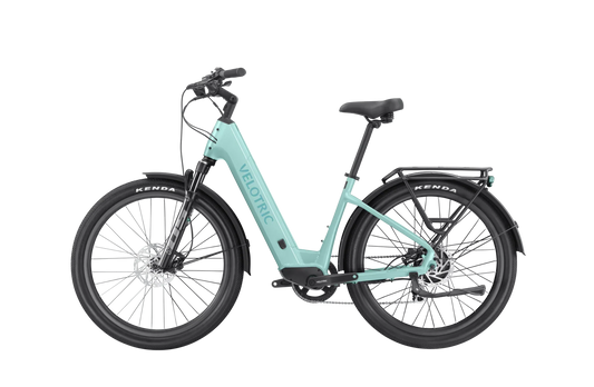 A sleek Velotric Discover 2 eBike in matte black, shown from a side angle with a step-through frame, front suspension fork, integrated battery, and rear cargo rack.