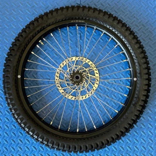 Product image of the eMOTO Surron eMoto Wheel Set, featuring a 21x1.6 front wheel and tire designed for E-Moto dirt bike use, shown without rotor or sprocket.