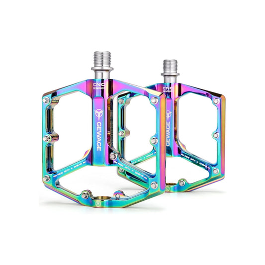 Rainbow-colored alloy bicycle pedals on a white background.
