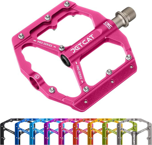 Pink alloy eBike pedals with a textured surface, product model 679, displayed on a white background.