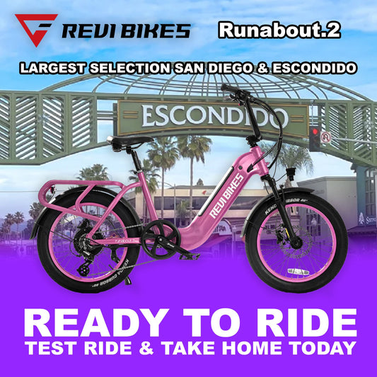 Pink eBike Revi Runabout.2 electric bicycle, side view, against a white background