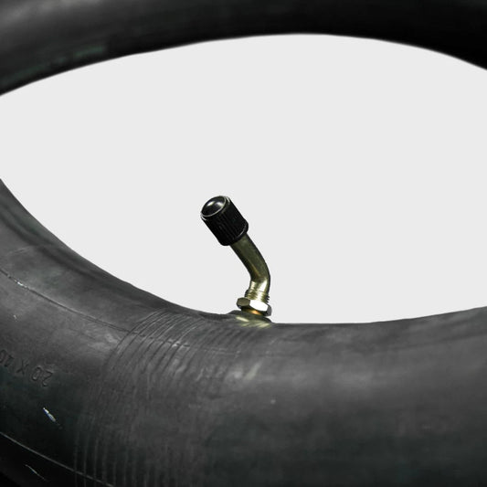 A 20x4.5/5.0-406 eBike inner tube from Tire Co. displayed coiled with a visible valve stem, set against a plain background.