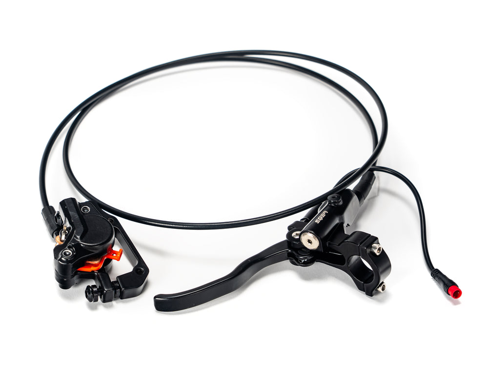 Stomp Ebox EBX rear brake system showing caliper, brake disc, and mounting hardware on a white background