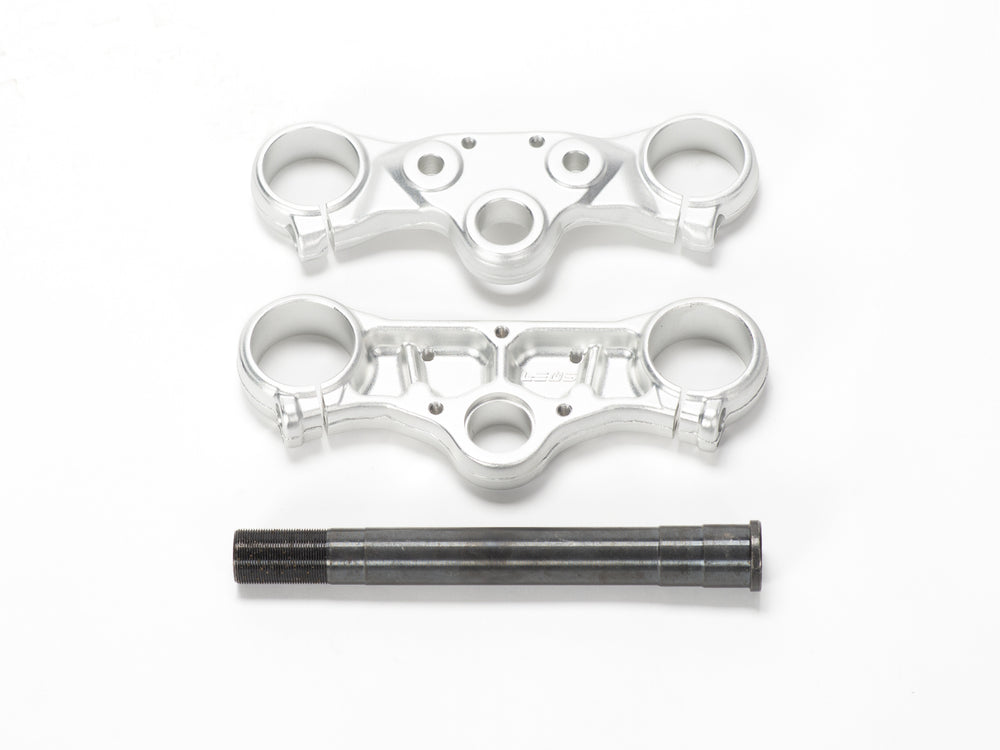 Stomp Ebox triple clamps with steerer, front view showing black anodized finish and precision-machined aluminum construction.