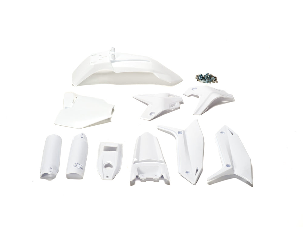 White plastic kit components for Stomp Ebox, including fenders, side panels, and number plate, displayed on a plain background.