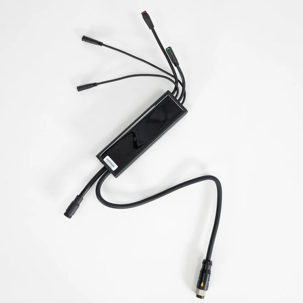 Close-up view of a Super73 S-Series electric bike controller, showing wiring connections and electronic components.