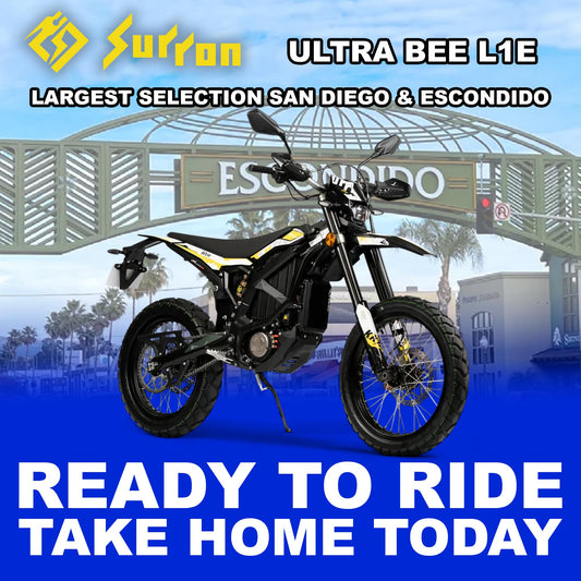 Black eMOTO Surron Ultra Bee L1E 12.5kW electric motorcycle, side view, ready to ride, against a plain background.