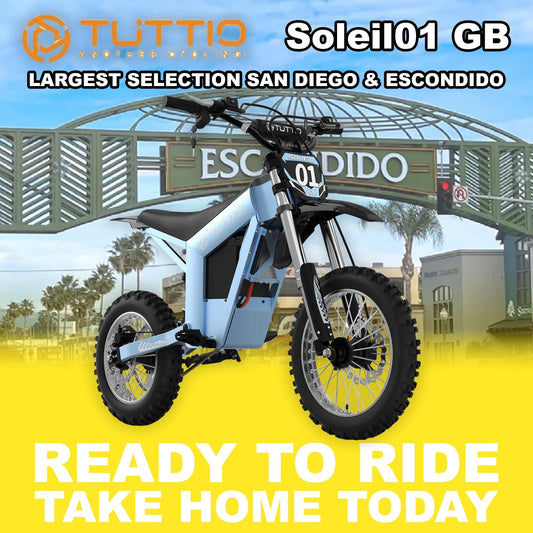 Electric motorcycle parked outdoors in sunlight, featuring a modern design with a matte finish and visible branding.