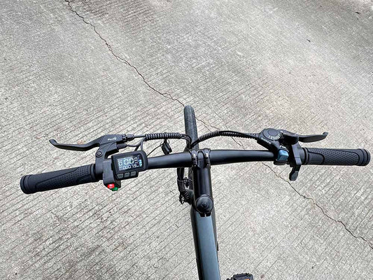 Side view of the FREEGO E7 Electric Town eBike in step-over frame design, featuring a 250w motor, black frame, front suspension fork, and commuter-style handlebars.