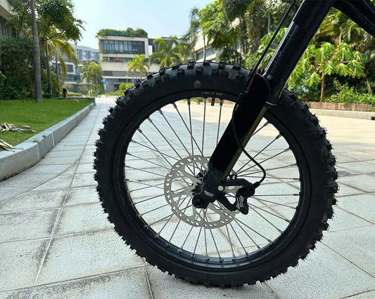 eMOTO FREEGO Natkie N1 Electric Dirt Bike, 4000W off-road eBike, black and green, side view, rugged tires, outdoor background