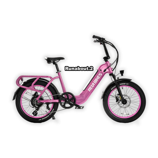 Pink eBike Revi Runabout.2 in box, product image showing packaged bicycle